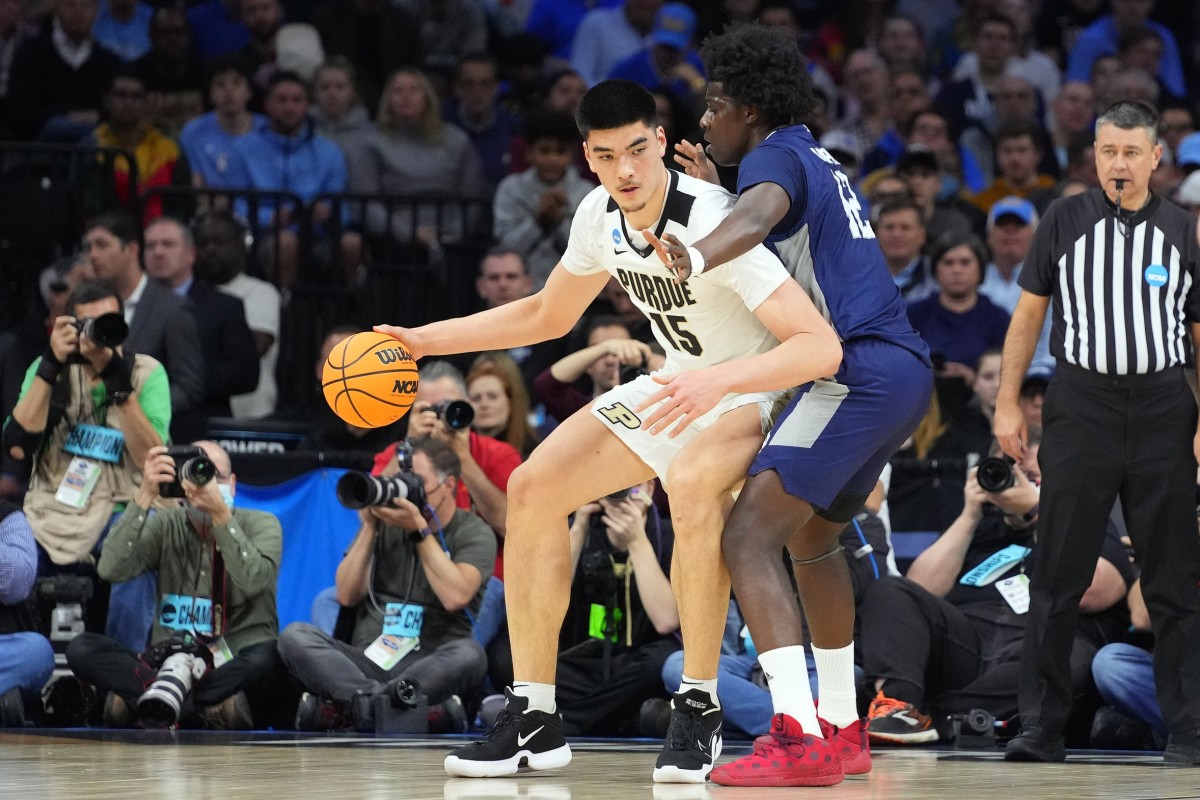 Mar 25, 2022; Philadelphia, PA, USA; Purdue Boilermakers center Zach Edey (15) controls the ball against St. Peter's Peacocks forward Clarence Rupert (12) in the first half in the semifinals of the East regional of the men's college basketball NCAA Tournament at Wells Fargo Center.