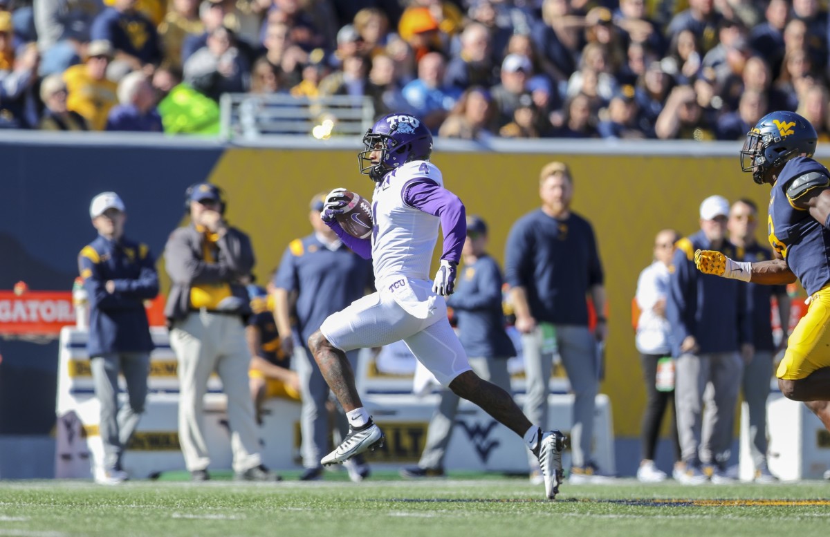 TCU Horned Frogs wide receiver Taye Barber (4) makes a catch and runs for a touchdown during the first quarter against the West Virginia Mountaineers at Mountaineer Field at Milan Puskar Stadium.