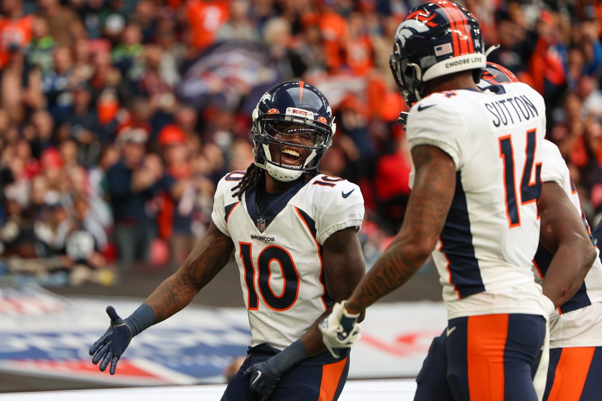 Denver Broncos wide receiver Jerry Jeudy (10) is congratulated by wide receiver Courtland Sutton (14) after scoring a touchdown against the Jacksonville Jaguars in the second quarter during an NFL International Series game at Wembley Stadium.