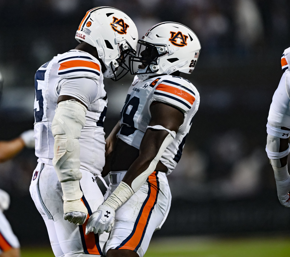 Nov 5, 2022; Starkville, MS, USA; Colby Wooden (25) and Derick Hall (29) celebrate sack during the game between Auburn and Mississippi State at Davis Wade Stadium . Todd Van Emst / AU Athletics