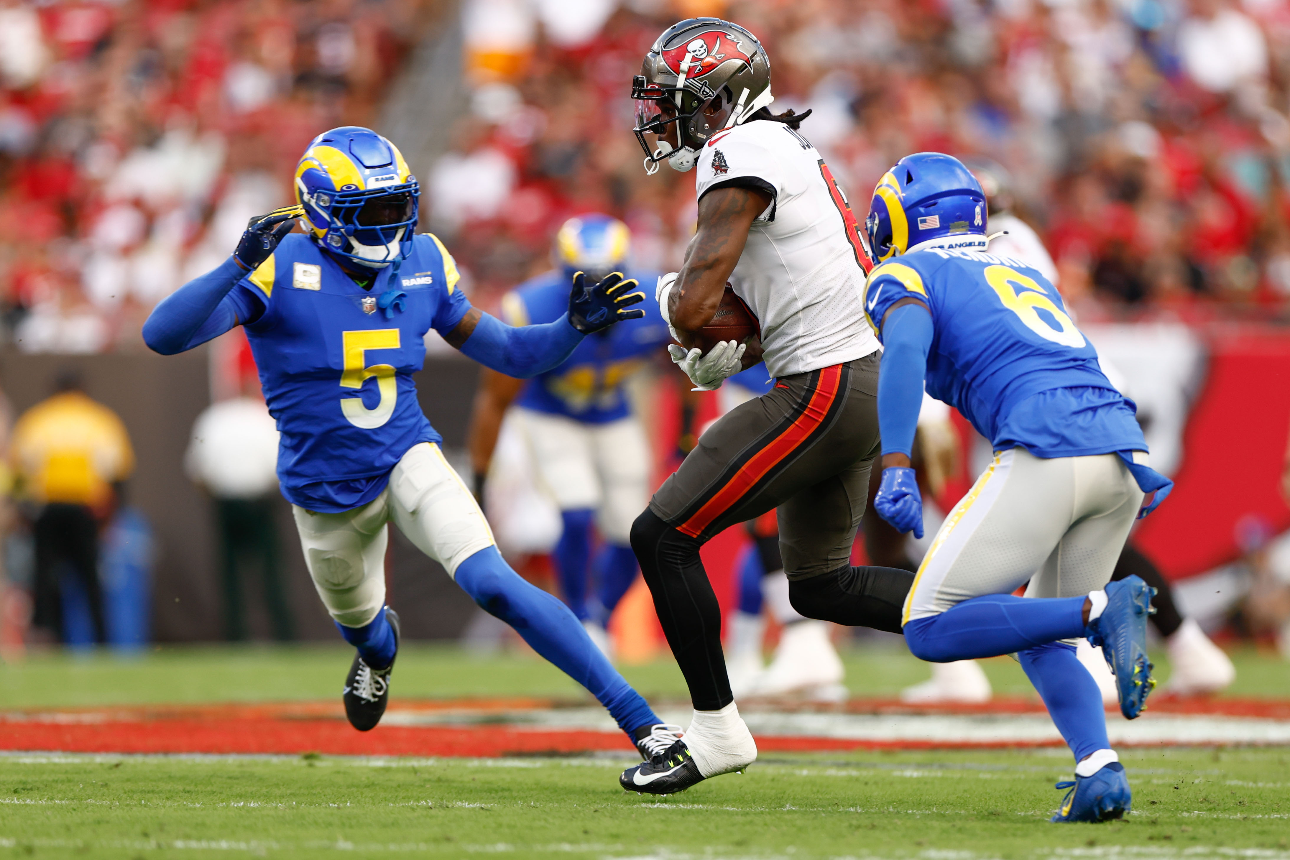 Los Angeles Rams cornerback Jalen Ramsey (5) grabs the jersey of Carolina  Panthers quarterback PJ Walker (11) for a sack during an NFL football game  Sunday, Oct. 16, 2022, in Inglewood, Calif. (