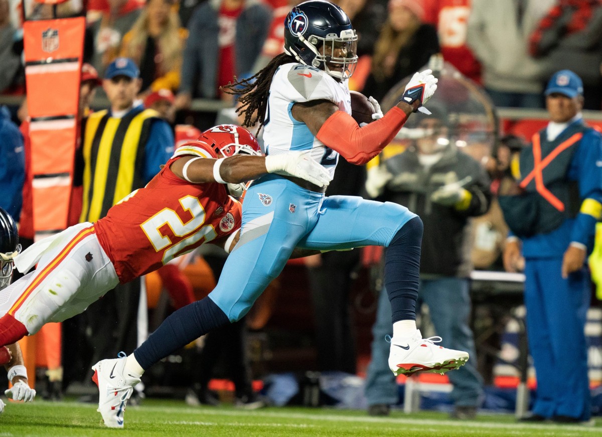 Tennessee Titans running back Derrick Henry (22) races past Kansas City Chiefs safety Justin Reid (20) during the second quarter at GEHA Field at Arrowhead Stadium Sunday, Nov. 6, 2022, in Kansas City, Mo. Nfl Tennessee Titans At Kansas City Chiefs