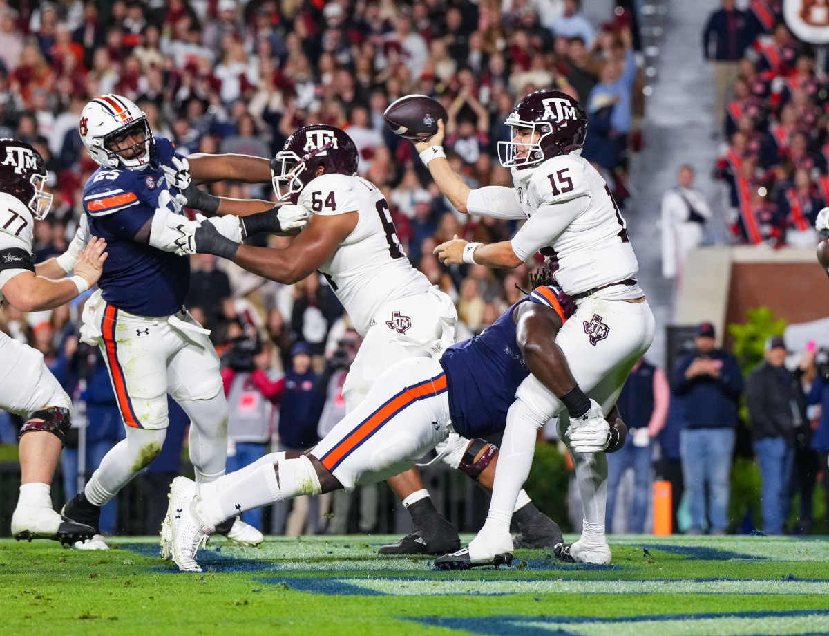 Marcus Harris (50) wraps up the quarterback for incompletion during the game between Auburn and Texas A&M at Jordan-Hare Stadium. Zach Bland/AU Athletics