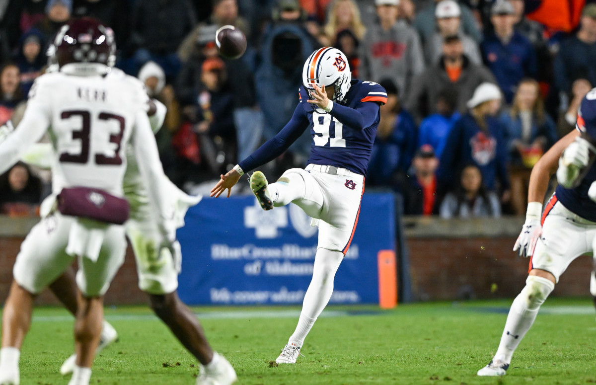 Oscar Chapman (91) punts the ball during the football game between the Texas A&M Aggies and the Auburn Tigers at Jordan Hare Stadium in Auburn, AL on Saturday, Nov 12, 2022. Todd Van Emst/Auburn Tigers