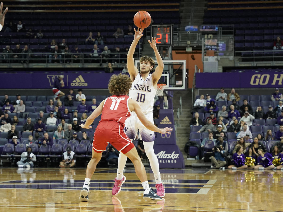 Freshman forward Tyler Linhardt lobs a pass inside against Utah Tech.