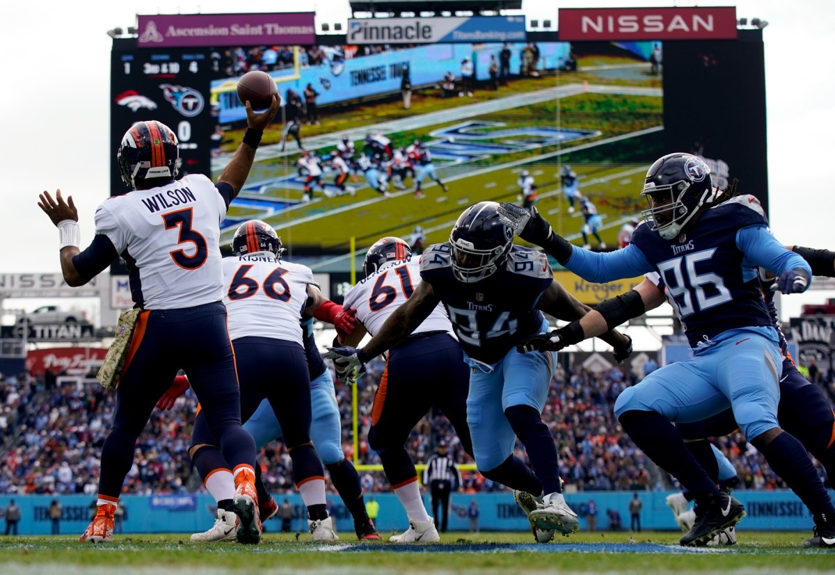 Denver Broncos orange-blue stripe uniform combo returns vs Titans