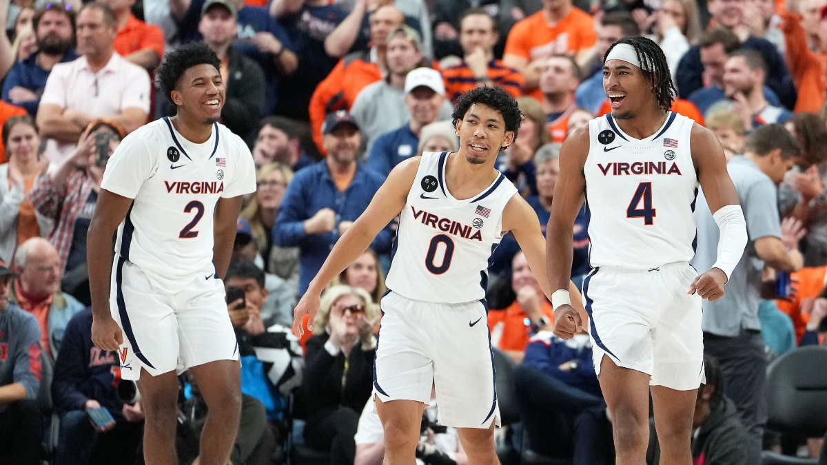 Virginia players smile during a win over Illinois