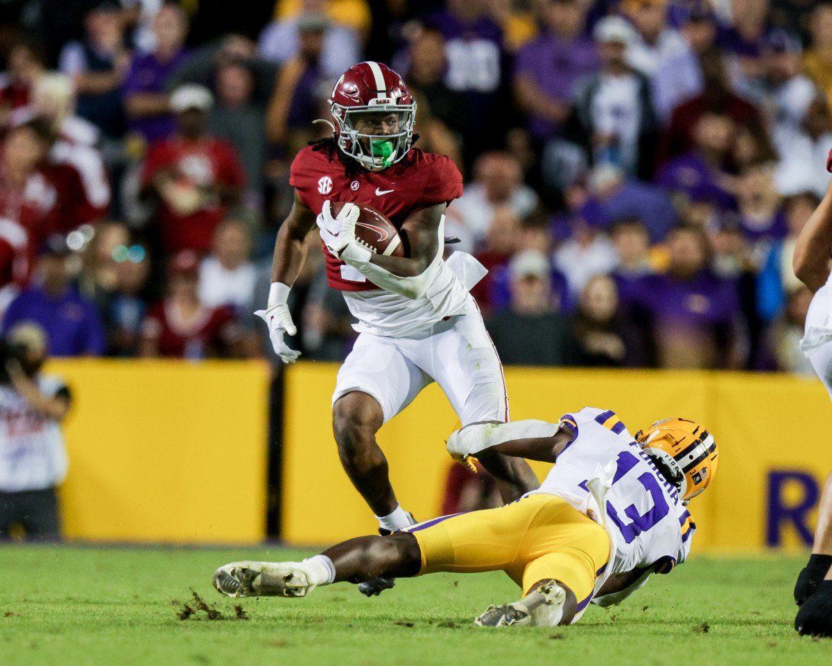 Nov 5, 2022; Baton Rouge, Louisiana, USA; Alabama Crimson Tide running back Jahmyr Gibbs (1) runs against LSU Tigers safety Joe Foucha (13) during the second half at Tiger Stadium. Mandatory Credit: Stephen Lew-USA TODAY Sports