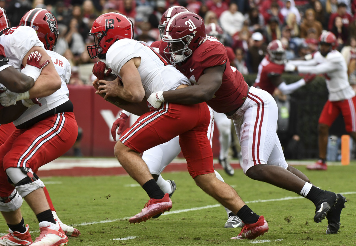 Nov 19, 2022; Tuscaloosa, Alabama, USA; Austin Peay quarterback Mike DiLiello (12) is tackled by Alabama linebacker Will Anderson Jr. (31) at Bryant-Denny Stadium. Mandatory Credit: Gary Cosby Jr.-USA TODAY Sports