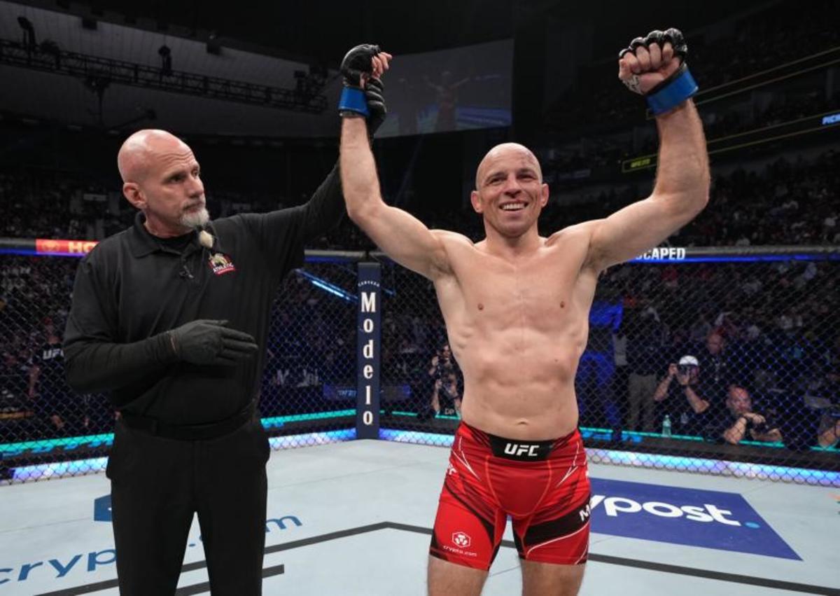 Mark Madsen has his hand raised following a UFC win.