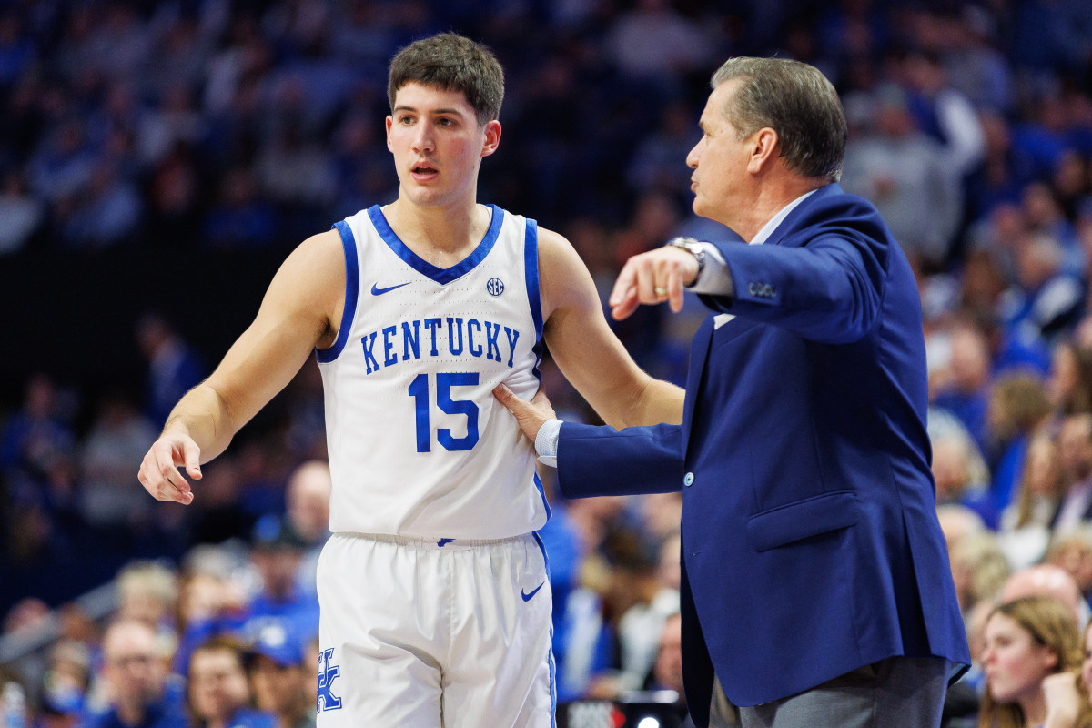 Jan 31, 2024; Lexington, Kentucky, USA; Kentucky Wildcats guard Reed Sheppard (15) talks with head coach John Calipari during the first half against the Florida Gators at Rupp Arena at Central Bank Center. Mandatory Credit: Jordan Prather-USA TODAY Sports