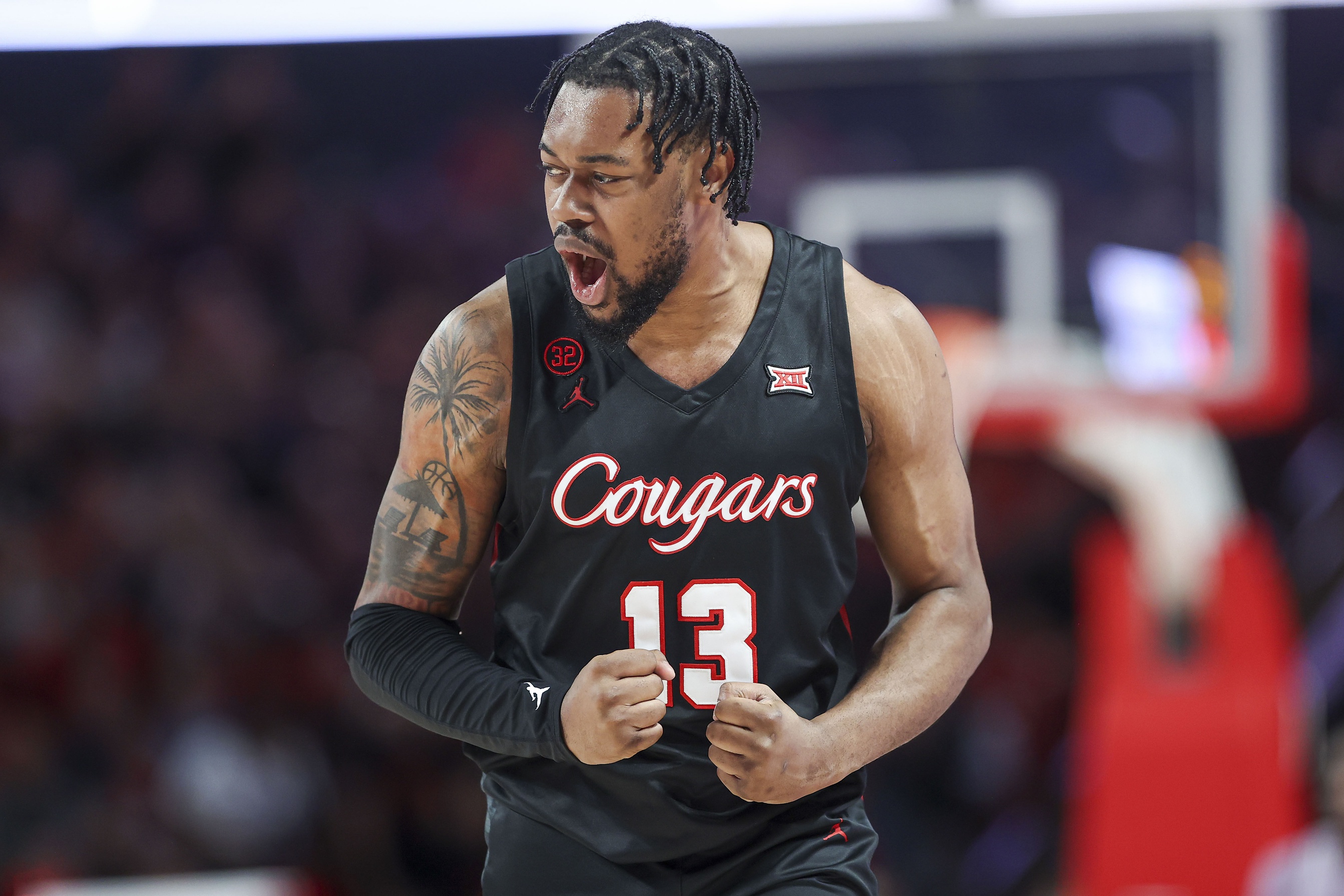 Houston Cougars forward J'Wan Roberts (13) reacts after a play during the first half against the Kansas State Wildcats at Fertitta Center.