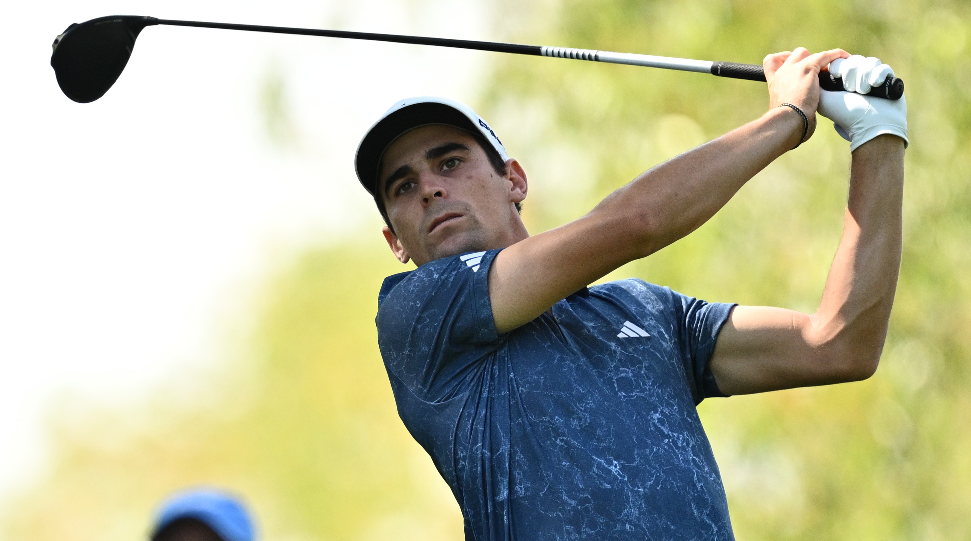 Chilean golfer Joaquin Niemann tees off during a hole at a LIV Golf event.