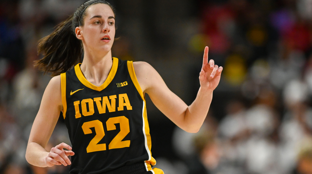 Iowa guard Caitlin Clark reacts to shooting a three-pointer.