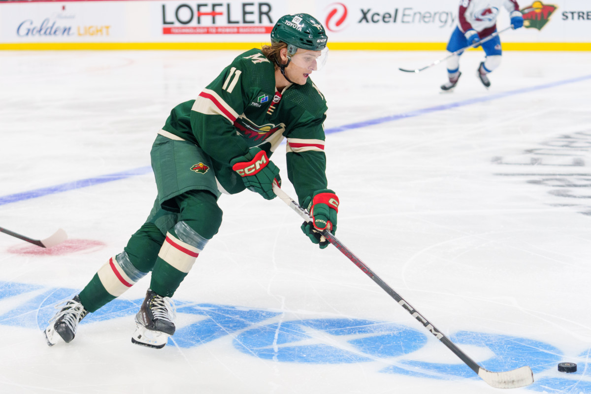 Sep 28, 2023; Saint Paul, Minnesota, USA; Minnesota Wild left wing Adam Beckman (11) skates against the Colorado Avalanche in the third period at Xcel Energy Center.