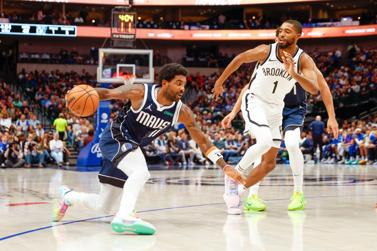 Dallas Mavericks guard Kyrie Irving (11) makes a move on Brooklyn Nets forward Mikal Bridges (1)