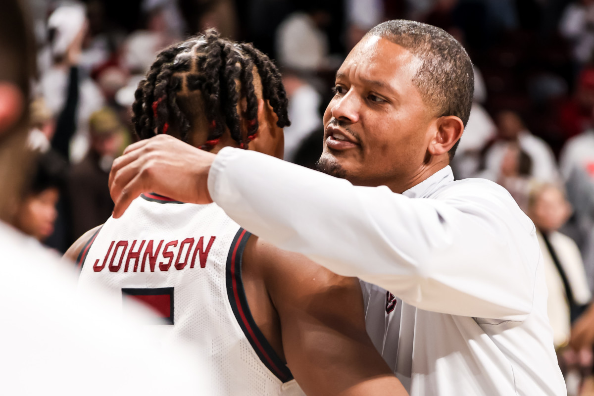 Lamont Paris hugs guard Meechie Johnson following their win over the Mississippi Rebels