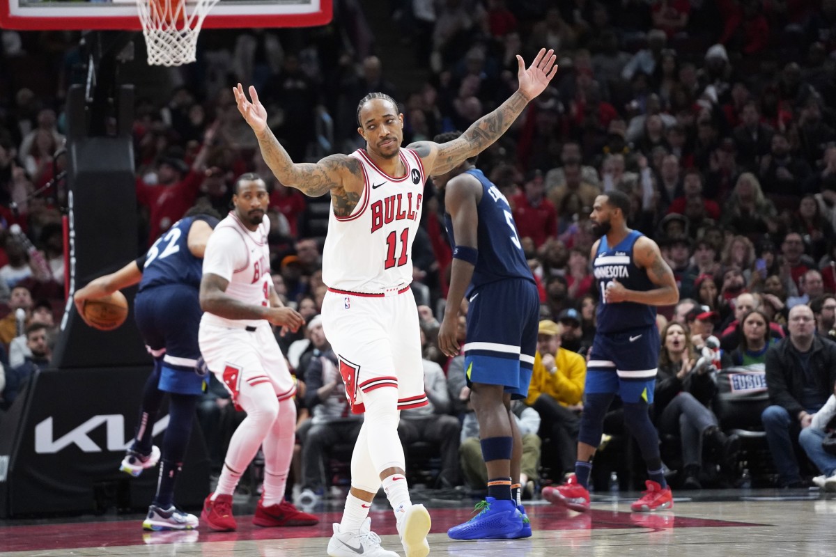 Chicago Bulls forward DeMar DeRozan (11) gestures after making a basket against the Minnesota Timberwolves during an overtime period at United Center