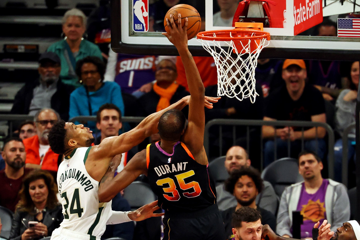 Phoenix Suns forward Kevin Durant (35) shoots the ball against Milwaukee Bucks forward Giannis Antetokounmpo (34)