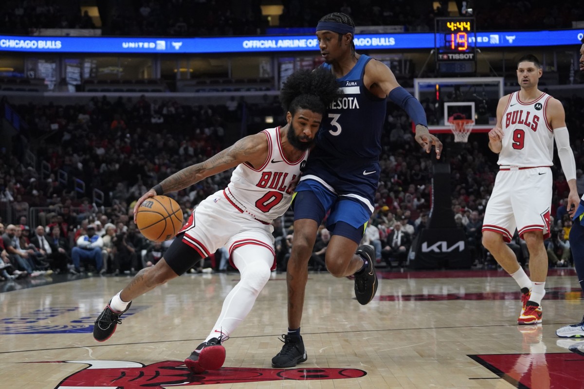 Minnesota Timberwolves forward Jaden McDaniels (3) defends Chicago Bulls guard Coby White (0) during the first quarter at United Center.