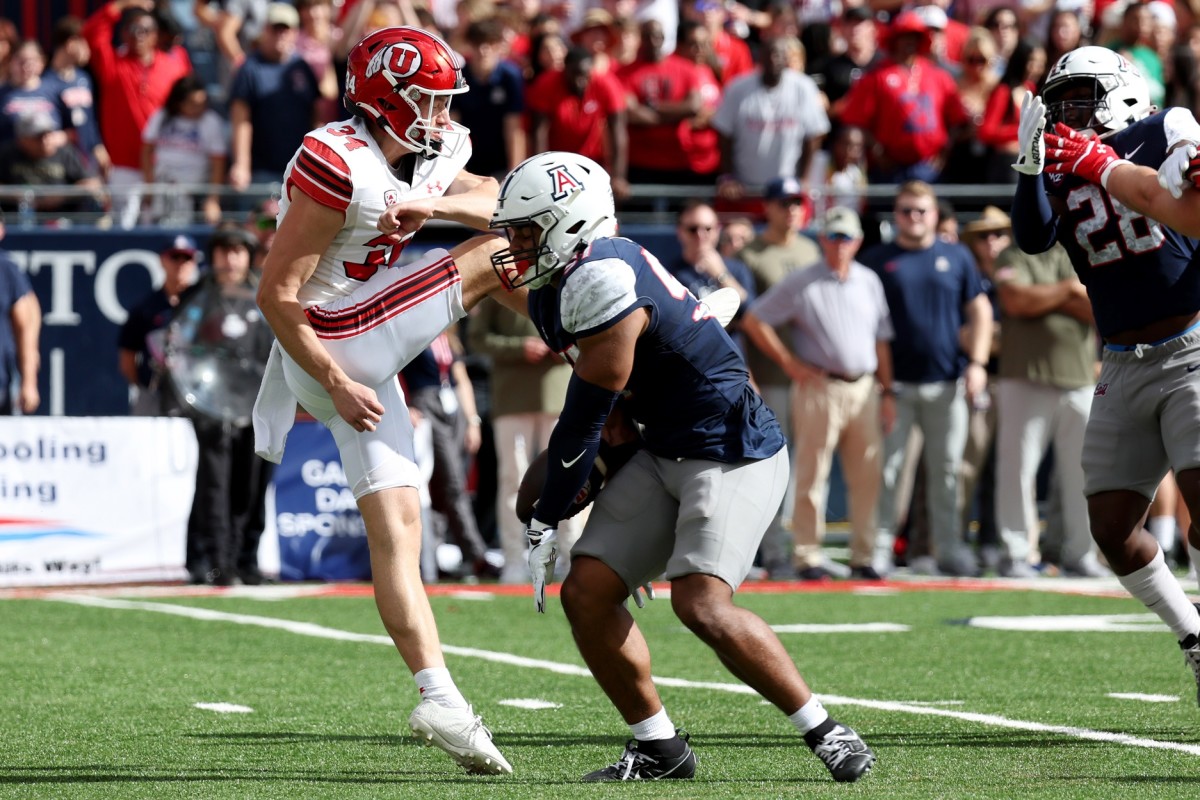 Anthony Ward breaks through to block a Utah punt, which he returned for a touchdown.