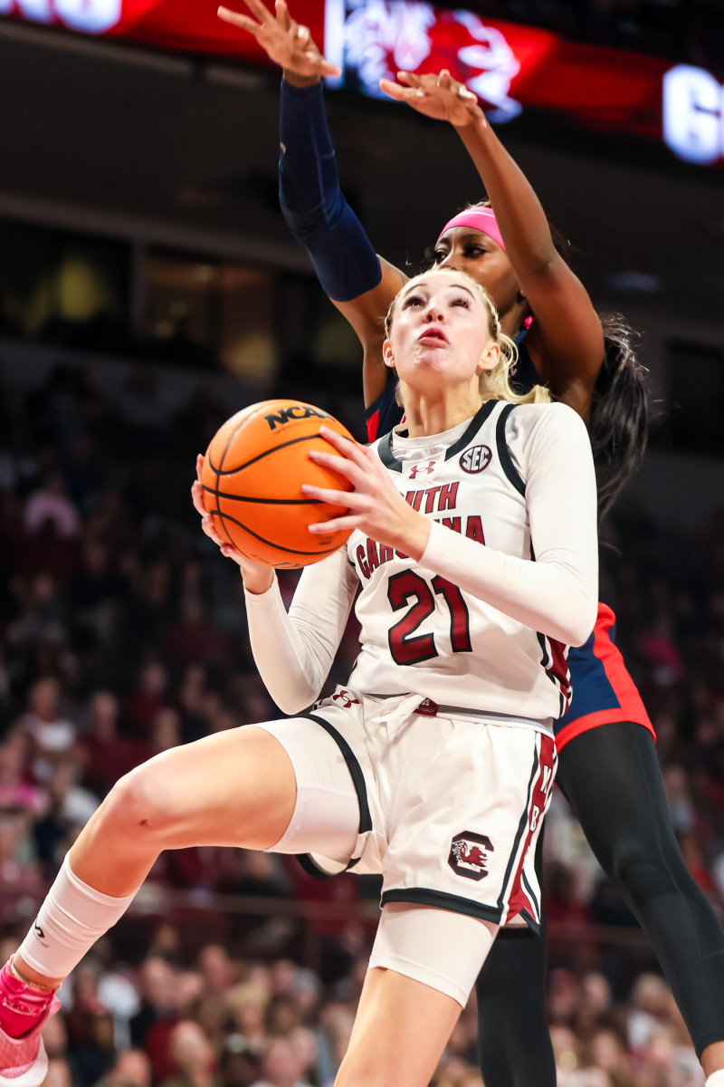 Chloe Kitts drives past Ole Miss Rebels guard.