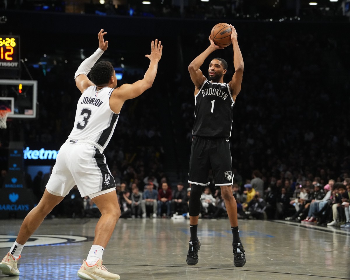 Brooklyn Nets small forward Mikal Bridges (1) shoots a three point jump shot over San Antonio Spurs small forward Keldon Johnson (3) during the second half at Barclays Center.