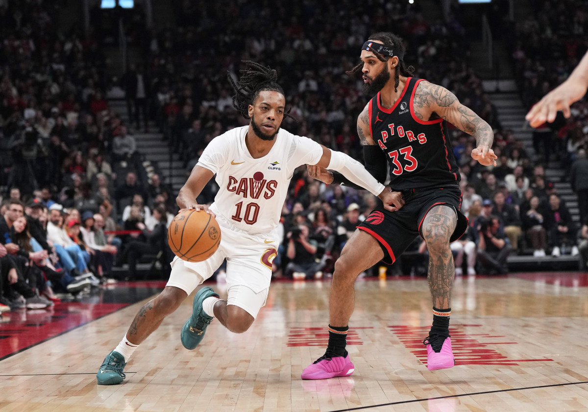 Feb 10, 2024; Toronto, Ontario, CAN; Cleveland Cavaliers guard Darius Garland (10) controls the ball as Toronto Raptors guard Gary Trent Jr. (33) tries to defend during the first quarter at Scotiabank Arena.