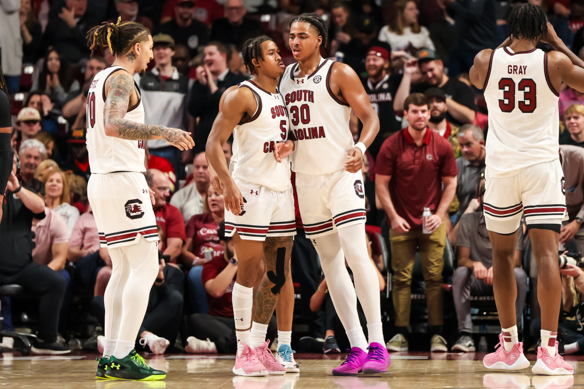 Meechie Johnson and forward Collin Murray-Boyles chest bump after making a play against the Vanderbilt Commodores (10th Feb., 2024)