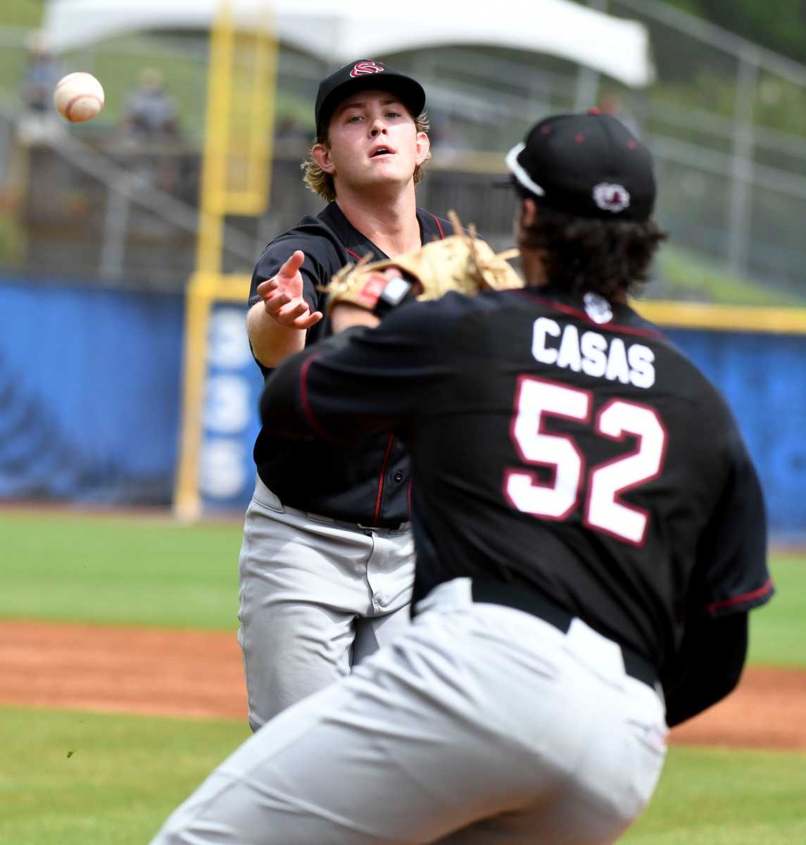 Eli Jones flips the ball to first baseman Gavin Casas to record an out against LSU (05-24-23)