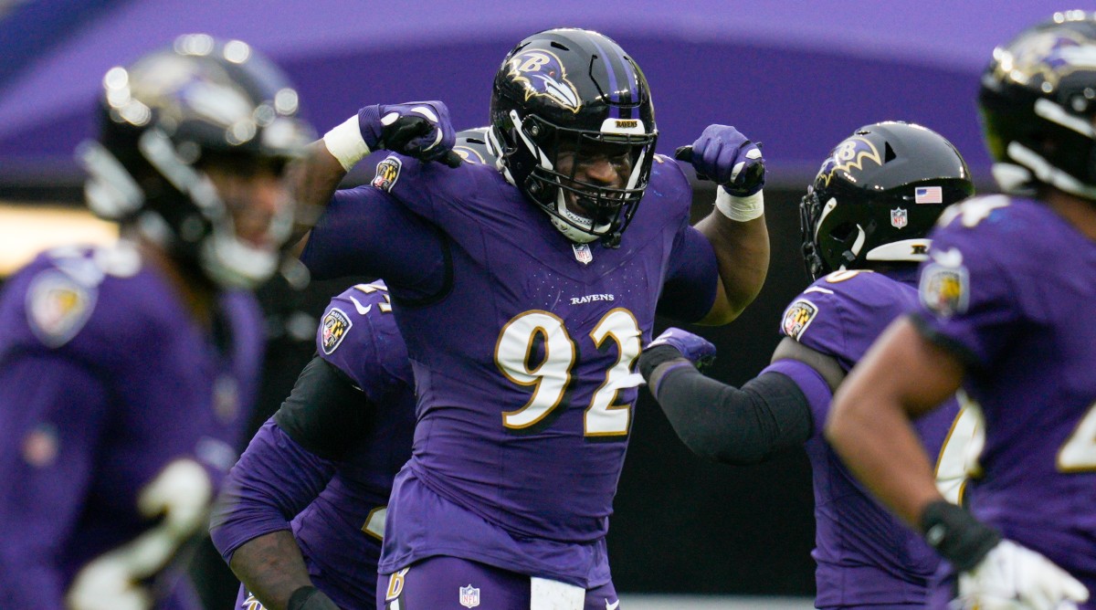 Baltimore Ravens defensive tackle Justin Madubuike (92) celebrates a sack during the first quarter of a game against the Los Angeles Rams.