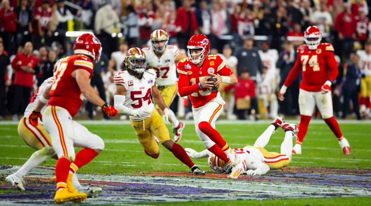 Chiefs quarterback Patrick Mahomes runs a play in Super Bowl LVIII overtime.