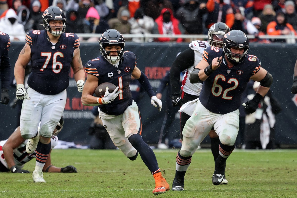 Chicago Bears quarterback Justin Fields (1) runs the ball against the Atlanta Falcons. Mandatory Credit: Mike Dinovo-USA TODAY