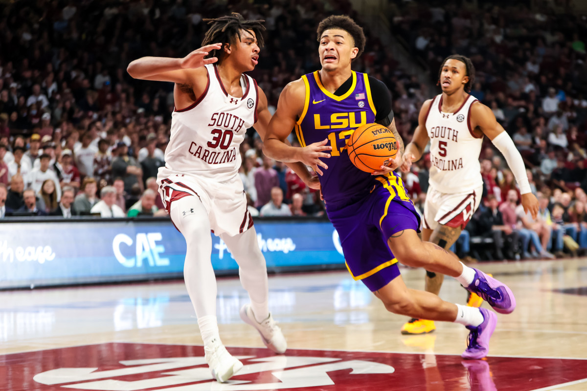 LSU Tigers forward Jalen Reed drives around Gamecock forward Collin Murray-Boyles (02-17-24)