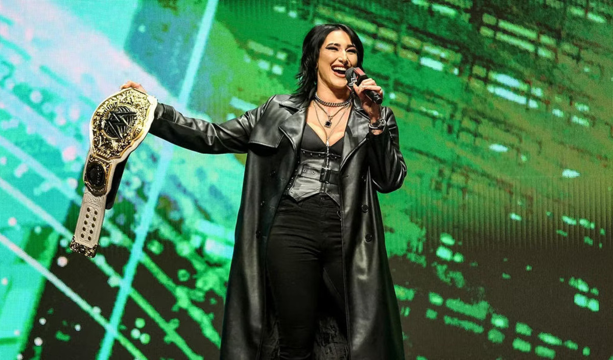 Rhea Ripley on stage with the Women's World Championship during the WrestleMania 40 Kickoff media event in Las Vegas.