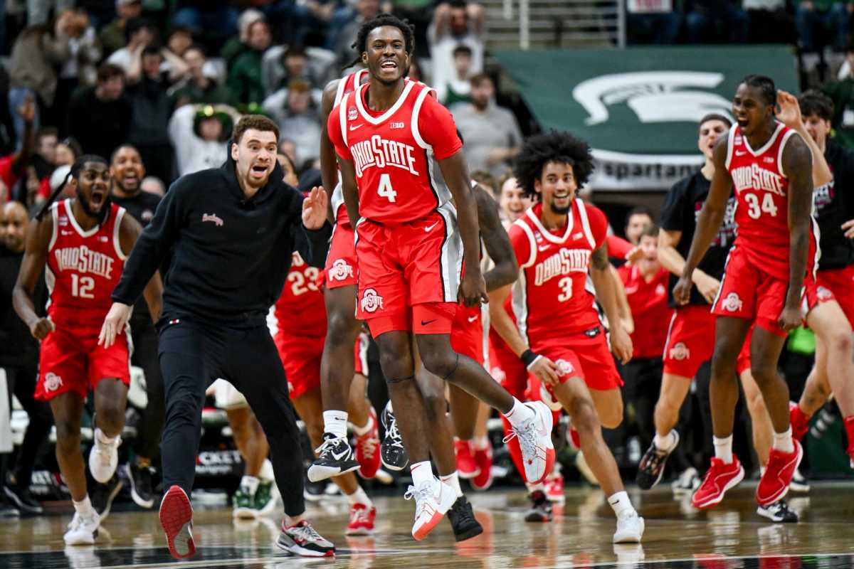 Ohio State's Dale Bonner, center, celebrates after hitting a game winning 3-pointer in the game against Michigan State on Sunday, Feb. 25, 2024, at the Breslin Center in East Lansing