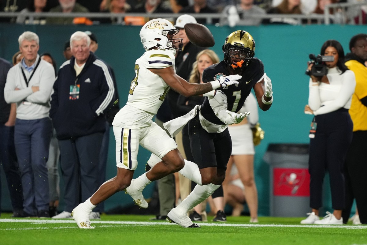 Dec 22, 2023; Tampa, FL, USA; UCF Knights wide receiver Javon Baker (1) catches a pass for a touchdown in front of UCF Knights defensive back Ja'Maric Morris (18) during the first half of the Gasparilla Bowl at Raymond James Stadium.