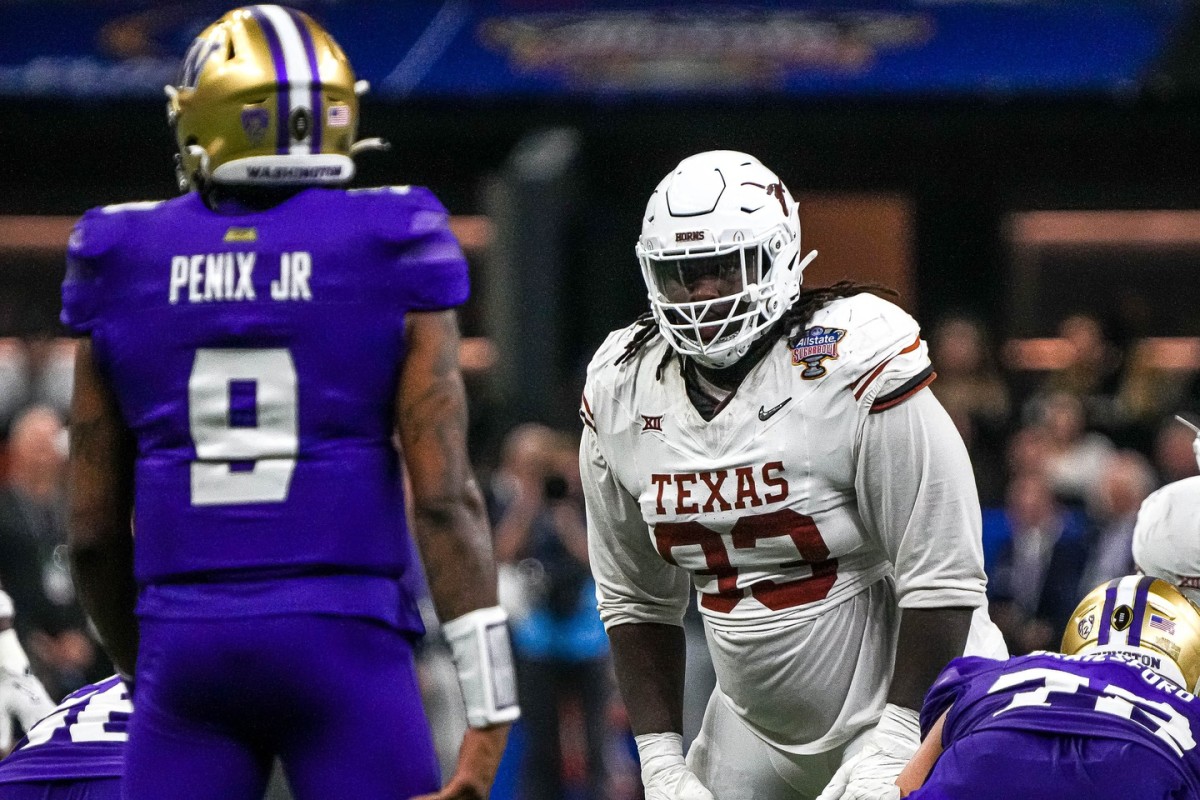 Texas Longhorns defensive lineman T'Vondre Sweat (93) watches Washington quarterback Michael Penix Jr. (9) before a snap during the Sugar Bowl College Football Playoff semifinals game at the Caesars Superdome on Monday, Jan. 1, 2024 in New Orleans, Louisiana.