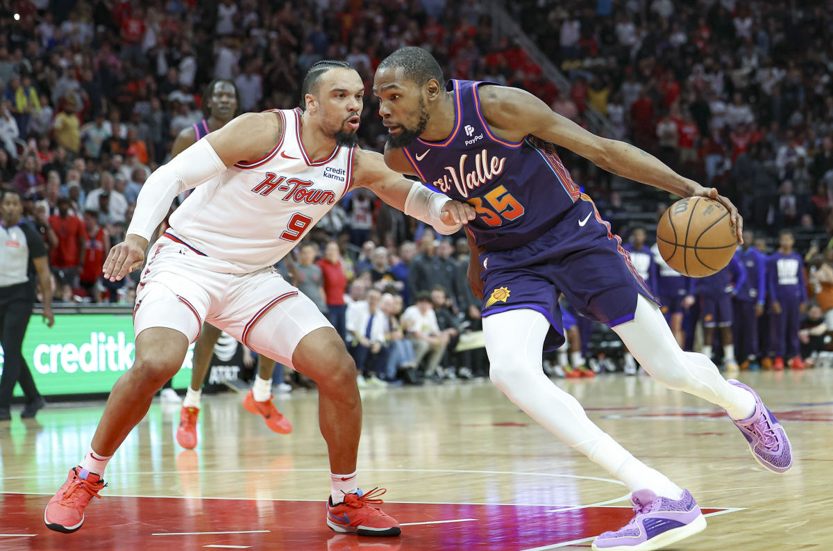 Suns forward Kevin Durant (35) drives to the basket as Houston Rockets forward Dillon Brooks (9) defends during the fourth quarter at Toyota Center.