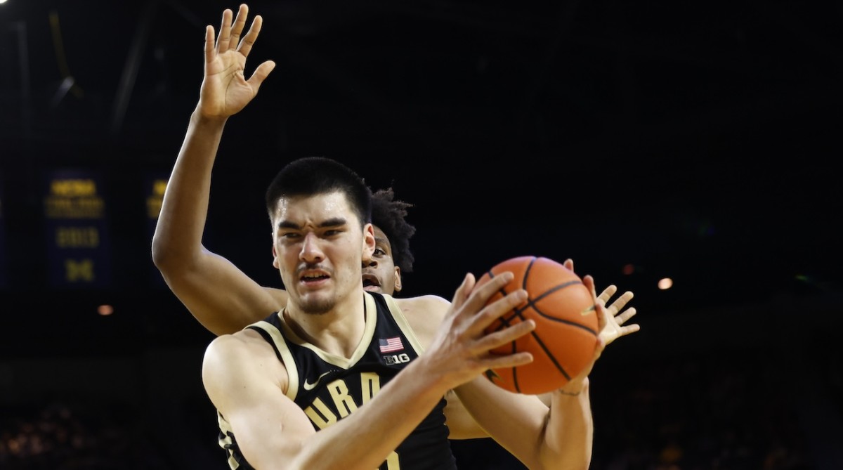 Purdue Boilermakers center Zach Edey (15) grabs the rebound over Michigan Wolverines forward Tarris Reed Jr. (32) in the second half at Crisler Center in Ann Arbor, Michigan, on Feb. 25, 2024.