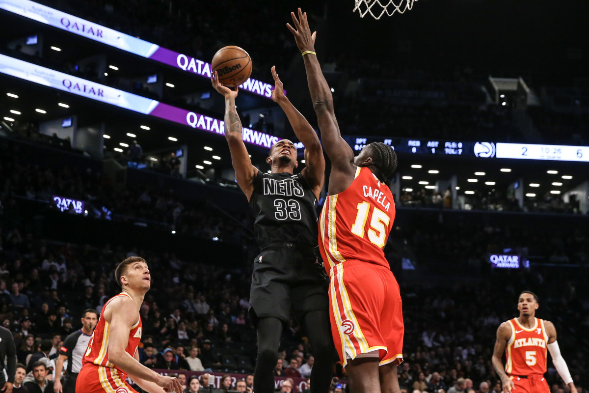 Feb 29, 2024; Brooklyn, New York, USA; Brooklyn Nets center Nic Claxton (33) moves to the basket against Atlanta Hawks center Clint Capela (15) in the first quarter at Barclays Center. Mandatory Credit: Wendell Cruz-USA TODAY Sports