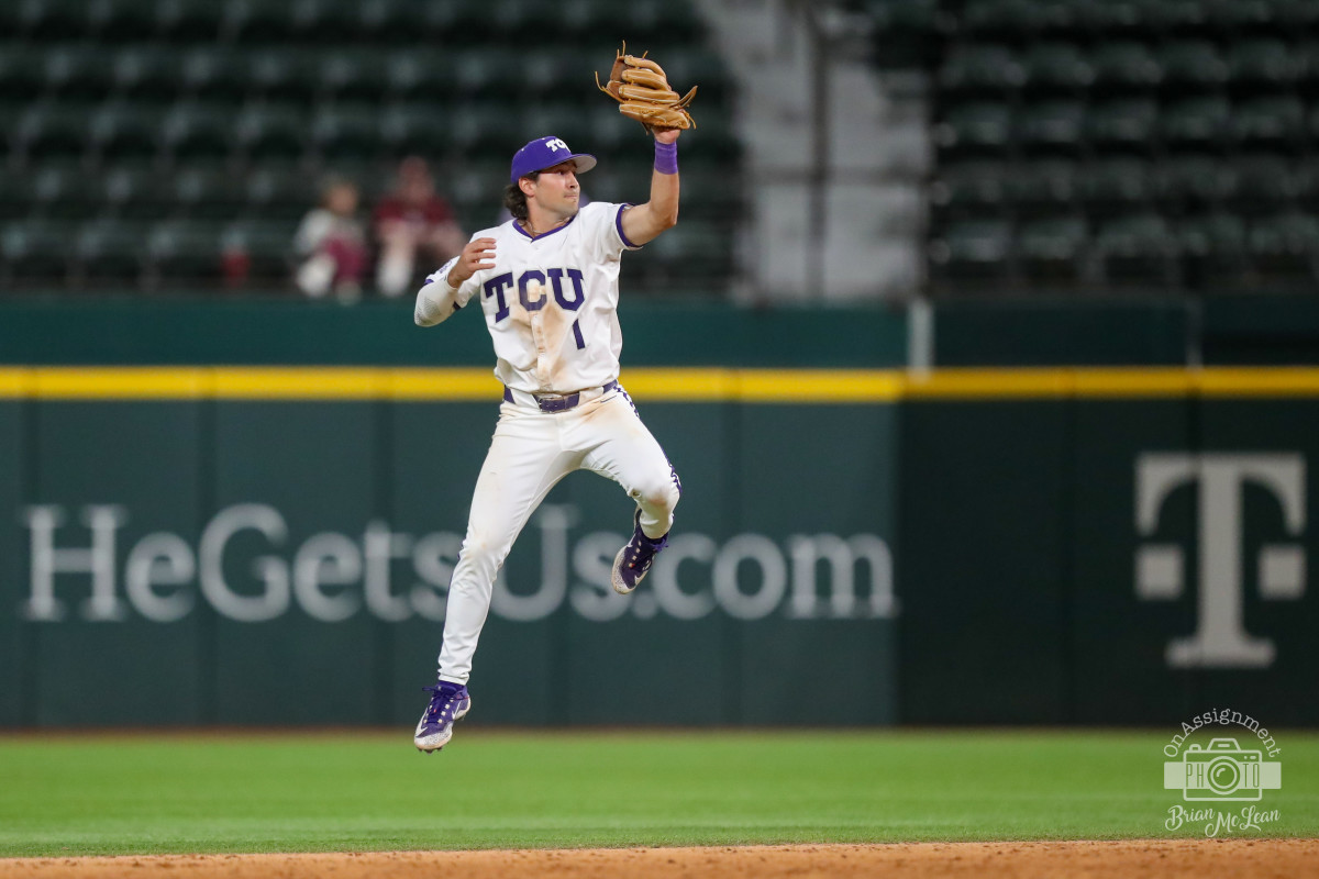 Peyton Chatagnier leaps up to keep a ball in the infield.