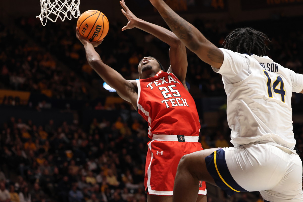 Texas Tech forward Rashard Jenning finishes a contested layup at the WVU Coliseum.