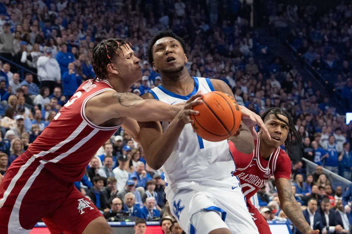 Kentucky Wildcats guard Justin Edwards (1) goes for a layup against Arkansas Razorbacks forward Trevon Brazile (2) during their game on Saturday, March 2, 2024 at Rupp Arena.