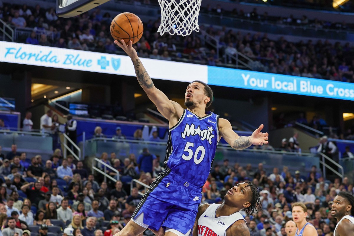 Cole Anthony goes up for a layup against Marcus Sasser.