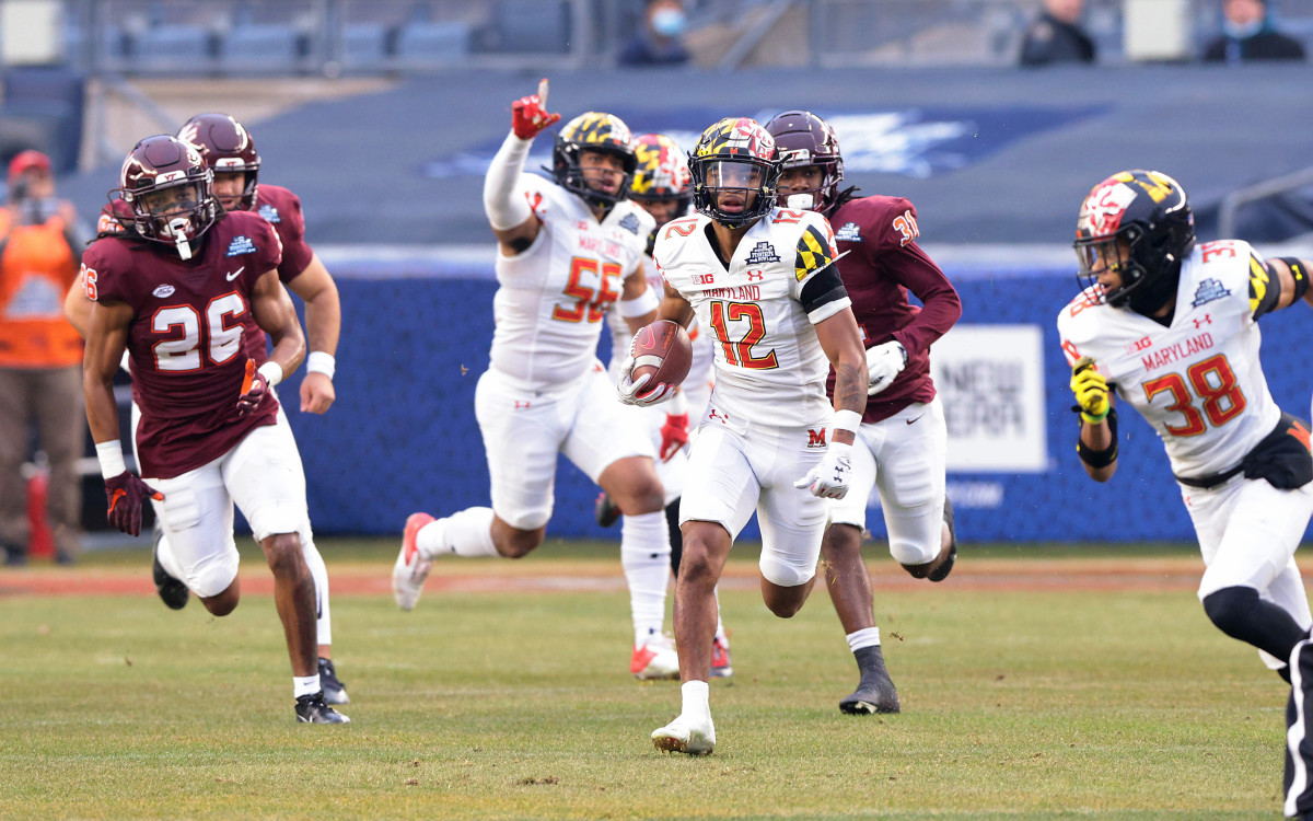 Maryland Terrapins punt returner Tarheeb Still (12) returns a punt for a touchdown.