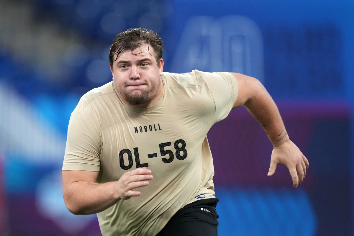 Oregon Ducks offensive lineman Jackson Powers-Johnson goes through drills at the 2024 NFL Scouting Combine in Indianapolis.