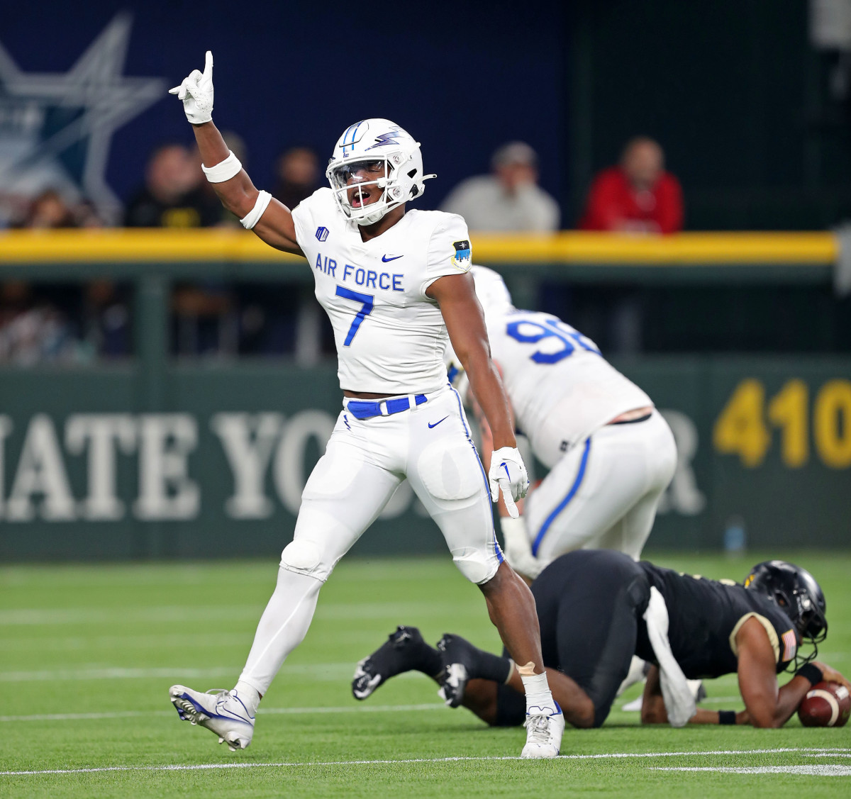 Air Force Falcons safety Trey Taylor (7) celebrates a sack of Army Black Knights quarterback Jemel Jones (7).