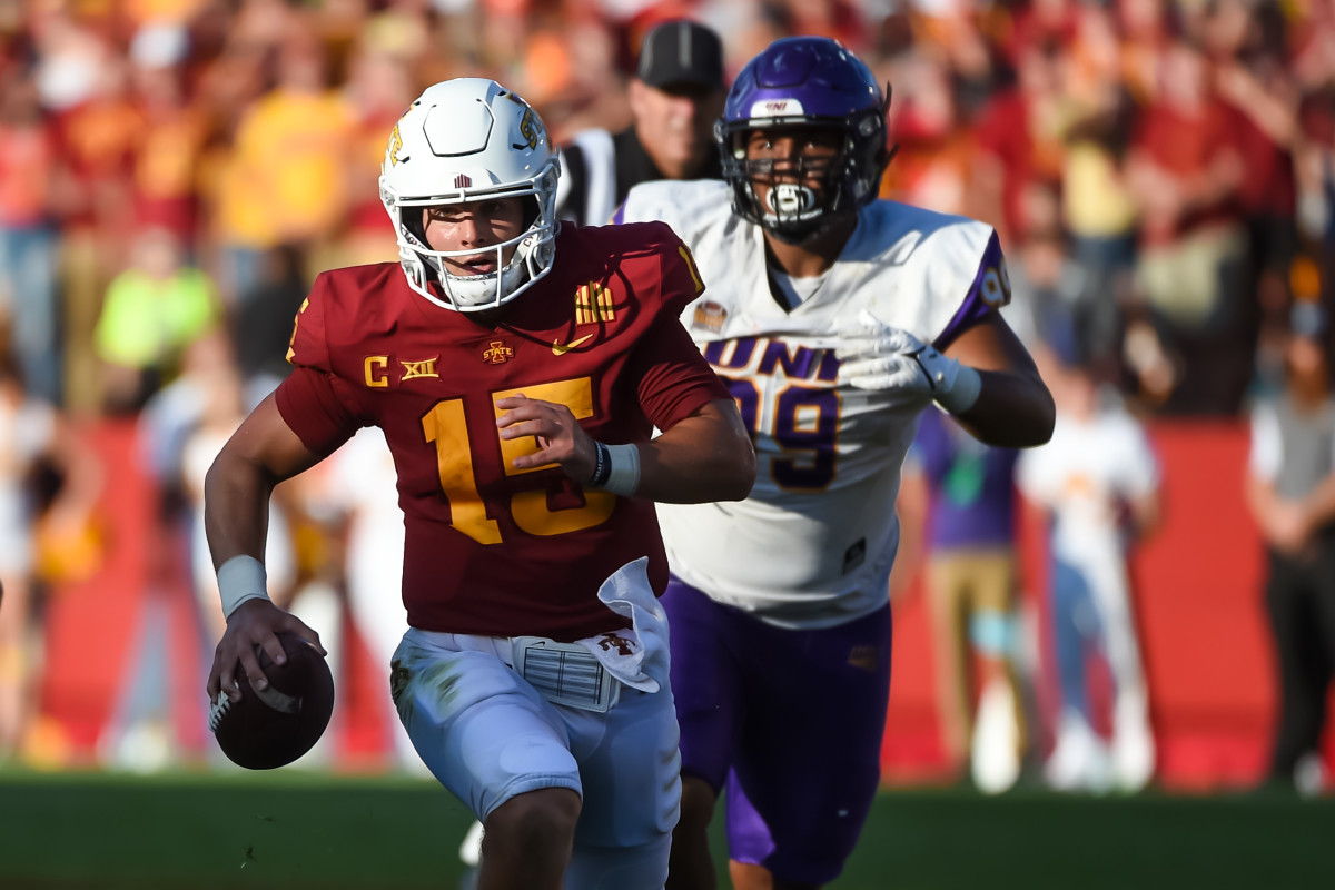 Sep 4, 2021; Ames, Iowa, USA; Iowa State Cyclones quarterback Brock Purdy (15) runs from Northern Iowa Panthers defensive lineman Khristian Boyd (99) in the second half at Jack Trice Stadium.