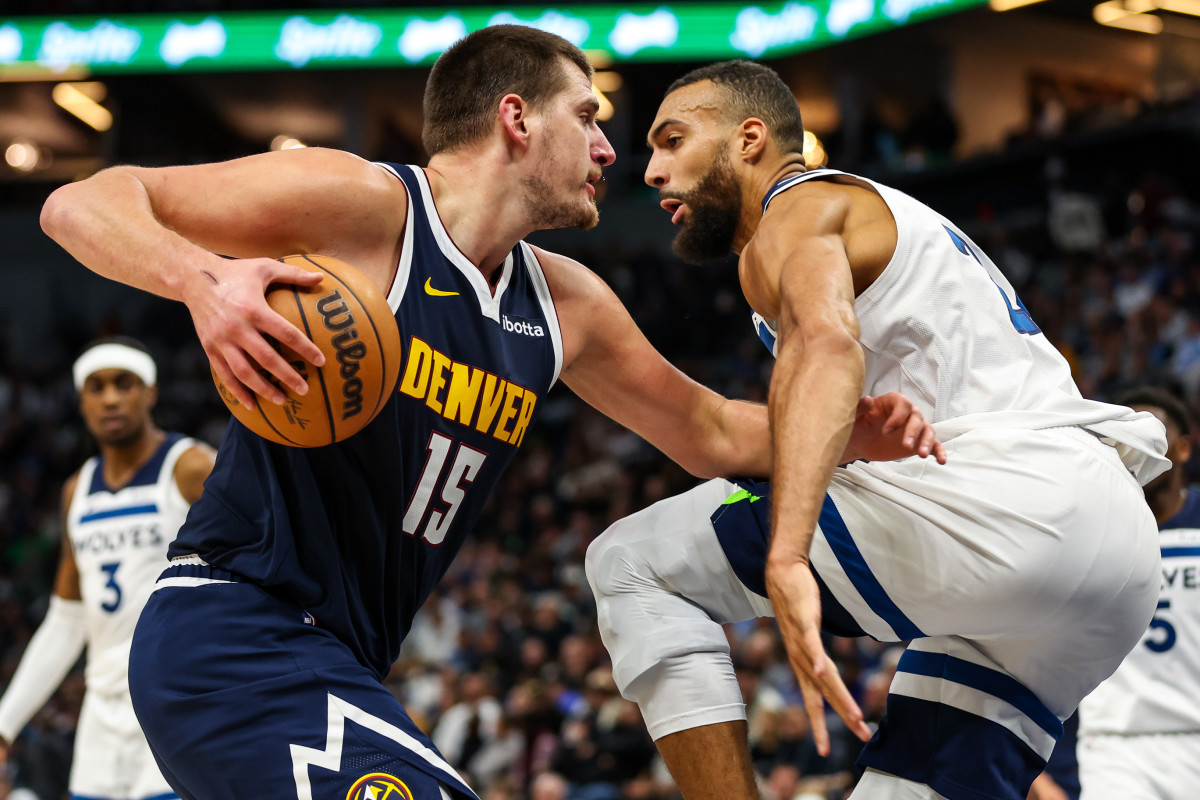 Nov 1, 2023; Minneapolis, Minnesota, USA; Denver Nuggets center Nikola Jokic (15) drives while Minnesota Timberwolves center Rudy Gobert (27) defends during the first half at Target Center.